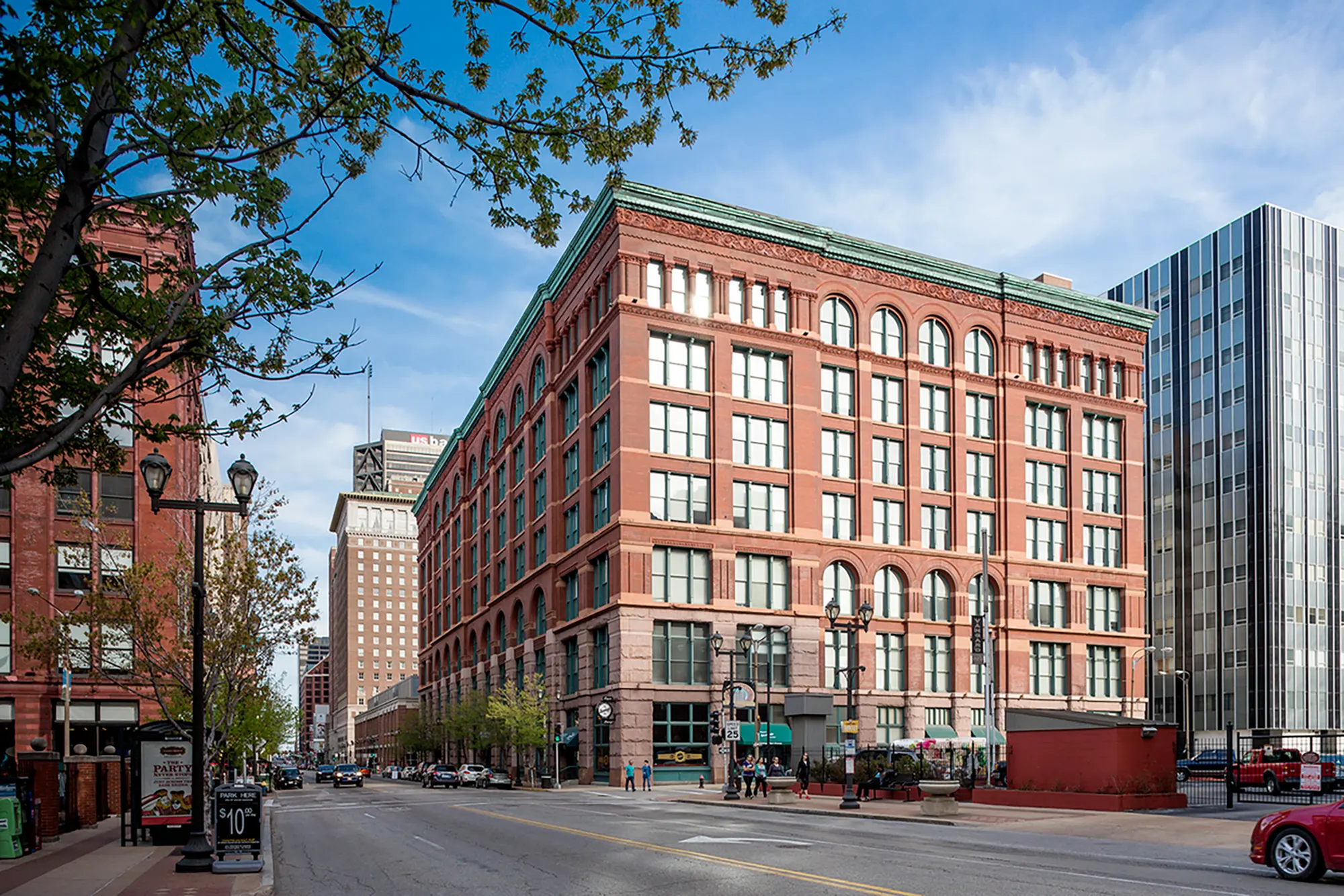 Close view of the brick exterior and large windows of Six Cord Apartments