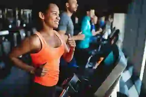 Woman Working Out in Fitness Center at Six Cord Apartments