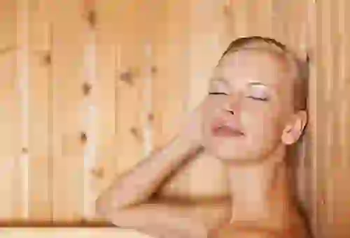 Woman relaxing in Sauna