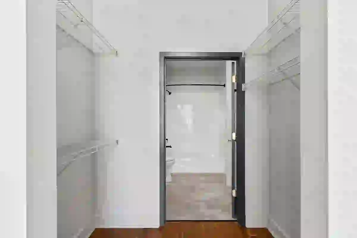 Large walk-in closet leading to private en-suite bathroom