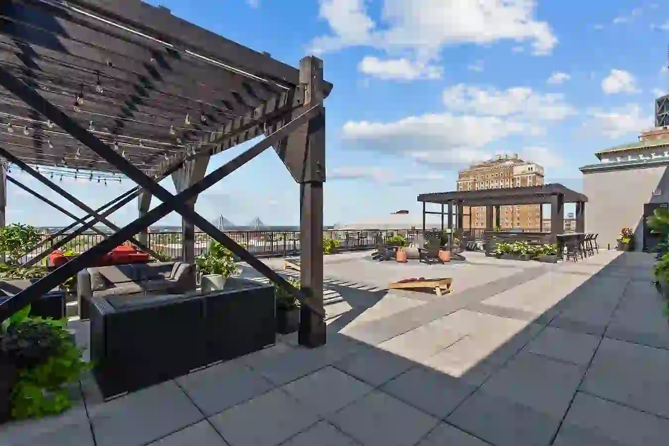 Gaming Area on Rooftop Deck with Cornhole, Pergola with Lounge Seating, Fire Pit, Grilling Station, and Downtown St. Louis City Views