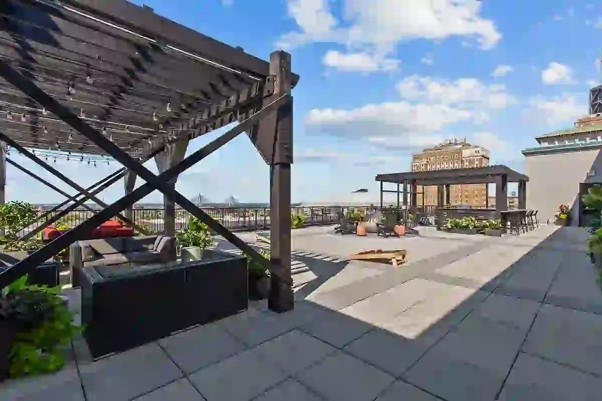 Rooftop Terrace at Six Cord Apartments with Gaming, Pergolas, Lounge Seating, Fire Pit, Cornhole, Grilling Station, and Downtown St. Louis City Views