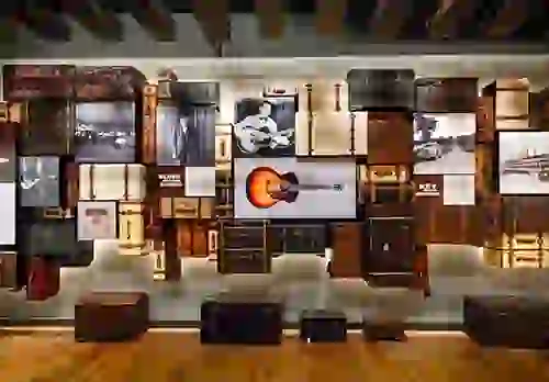 Interior exhibit at the National Blues Museum with guitars, amplofiers, and album art