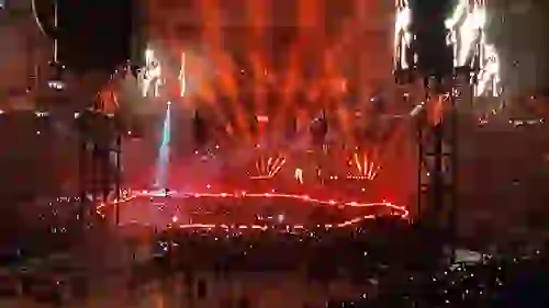 Nightime concert event with dramatic red lighting inside The Dome at America's Center