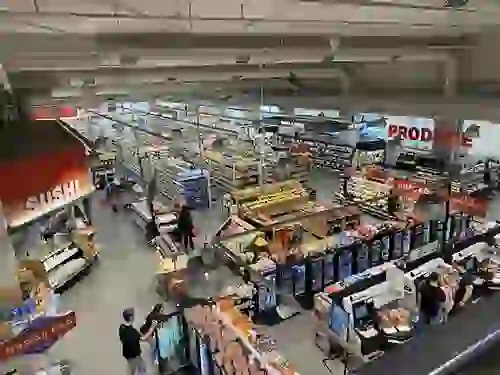 Wide shot of aisles and shopping at CVS Pharmacy