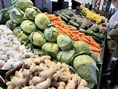 Fresh produce for sale on shelves at Soulard Farmer's Market
