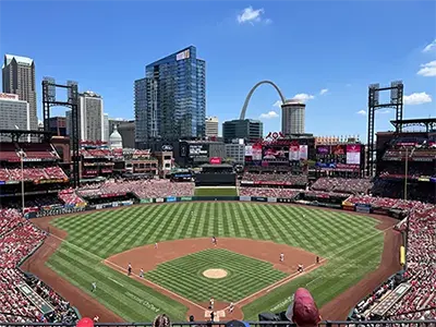 A wide shot of the field at Busch Stadium with the city skyline in the background