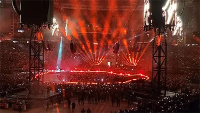 Nightime concert event with dramatic red lighting inside The Dome at America's Center