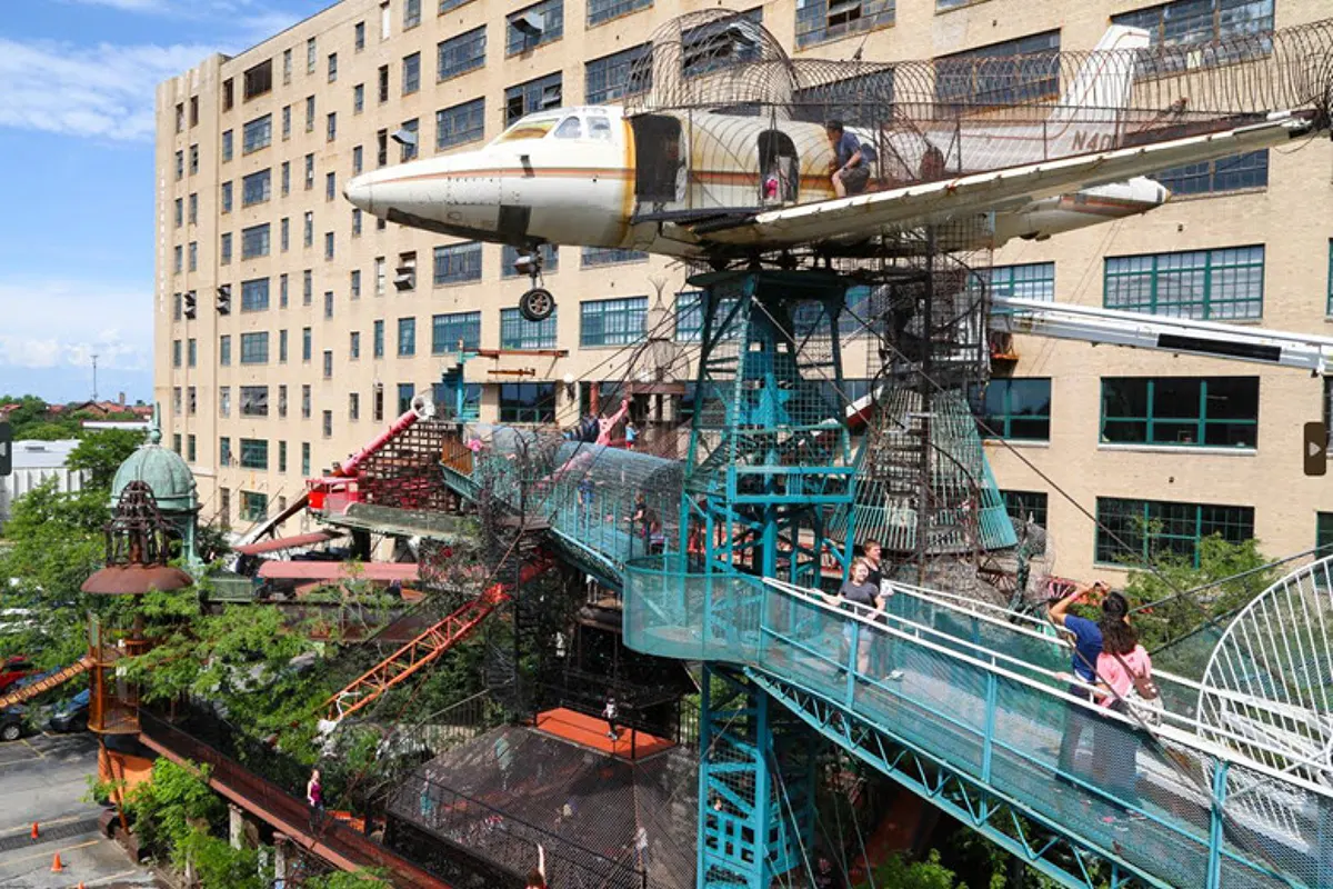 Repurposed airplane exhibit with teal walkways at City Museum