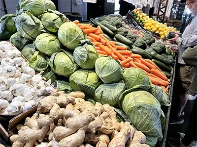 Fresh produce for sale on shelves at Soulard Farmer's Market